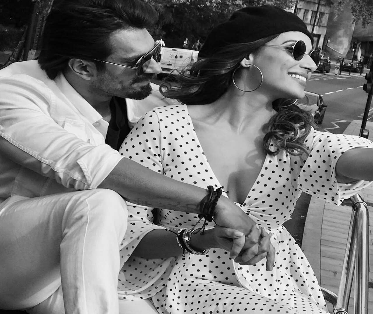 The actors keep tapping into their fun side from time to time. They are both sporting retro looks in this black-and-white click. Bipasha is channelling the 70s with a polka dot dress, big hoops, and puffed up hair, while Karan cuts a dashing figure in a vintage shirt, trousers and sunglasses